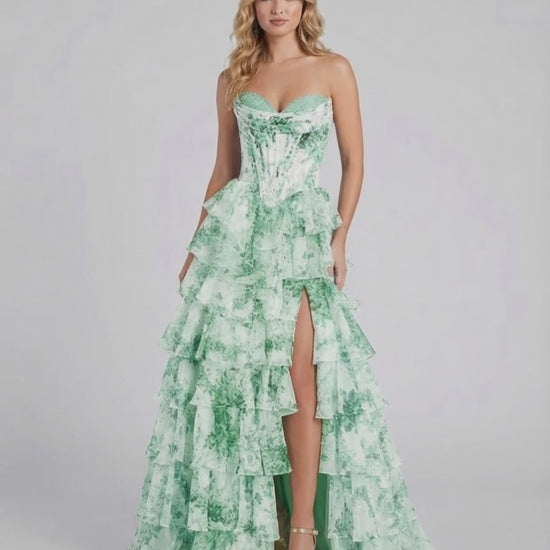 Serenella Maxi Dress by Lauven, a green floral chiffon dress featuring tiered ruffles and a strapless design.