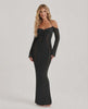 Model wearing Noir Maxi Dress, a black long sleeve bodycon gown with open back halter design by Lauven, showcasing elegant style.