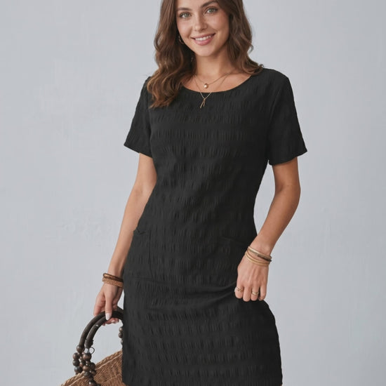 Avelin Mini Dress by Lauven, featuring textured fabric, round neckline, short sleeves, and a fresh modern look.