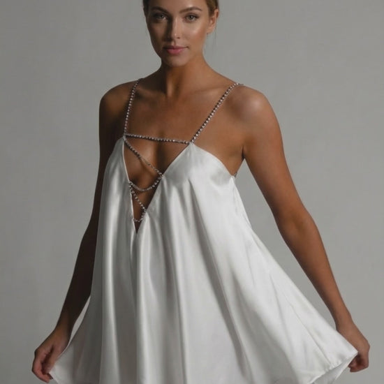 Aurora Mini Dress by Lauven in white satin with beaded straps and flared silhouette, perfect for elegant occasions.