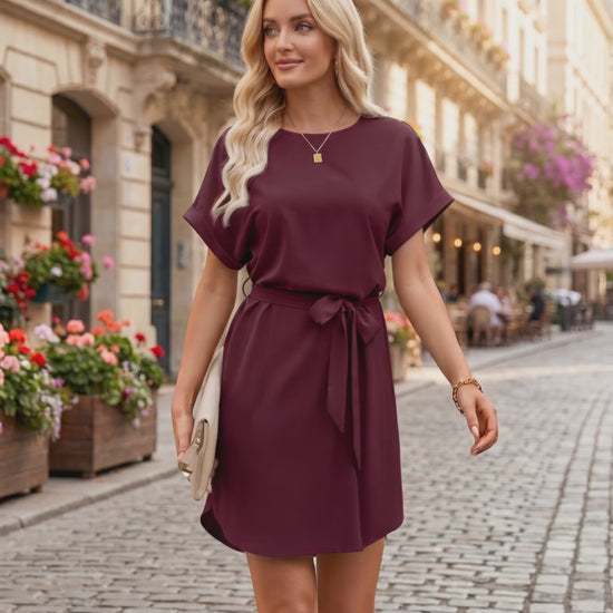Elara Mini Dress featuring smooth woven fabric, round neckline, relaxed bodice, and self-tie waist by Lauven.