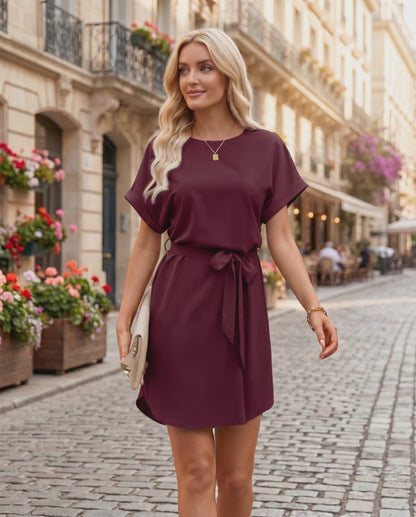 Elara Mini Dress featuring smooth woven fabric, round neckline, relaxed bodice, and self-tie waist by Lauven.