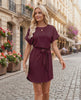 Elara Mini Dress featuring smooth woven fabric, round neckline, relaxed bodice, and self-tie waist by Lauven.