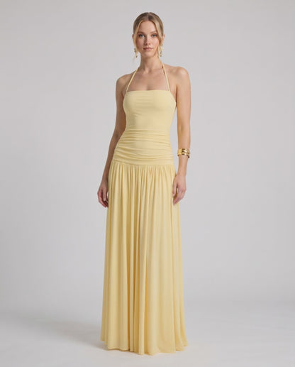 Elara Maxi Dress in soft yellow stretch jersey, features halter neck and ruched waist, by Lauven.