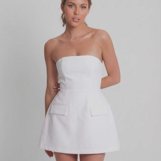 Elara Mini Dress | White strapless mini dress with structured A-line silhouette by Lauven, perfect for elevated occasions.