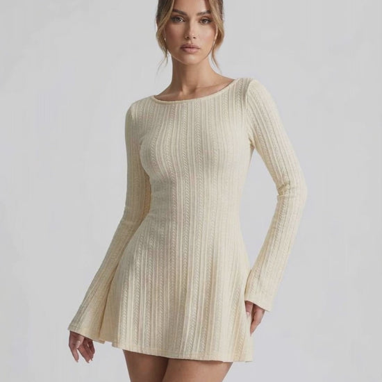 Orion Mini Dress featuring elegant cable knit, long flared sleeves, soft cream tone by Lauven.