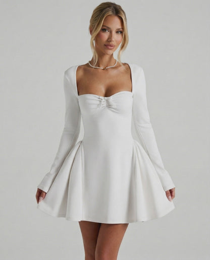 Lauven Luna Mini Dress featuring a classic white color, square neckline, long fitted sleeves, and flared skirt.