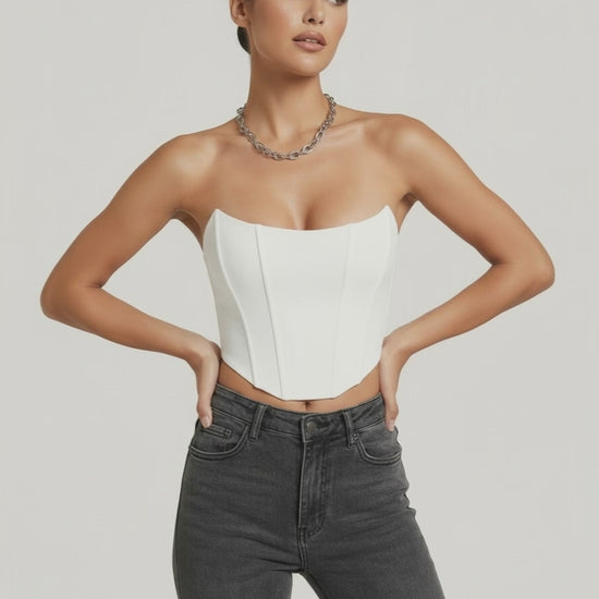 Model wearing the Luna Corset Top by Lauven, featuring a structured white velvet design and chic styling.