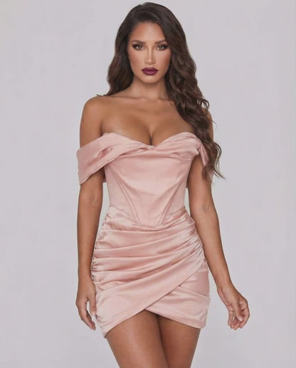 Lauven Orion Mini Dress in blush satin, off-shoulder neckline, elegant body-skimming silhouette with draped fold design.