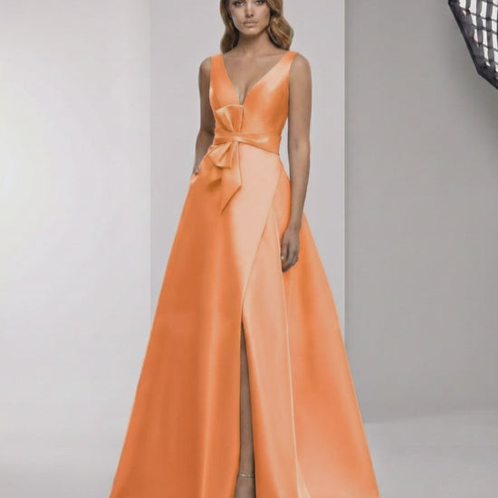 Solmira Maxi Dress in orange satin with wrap slit and bow waist, designed for elegant occasions by Lauven.