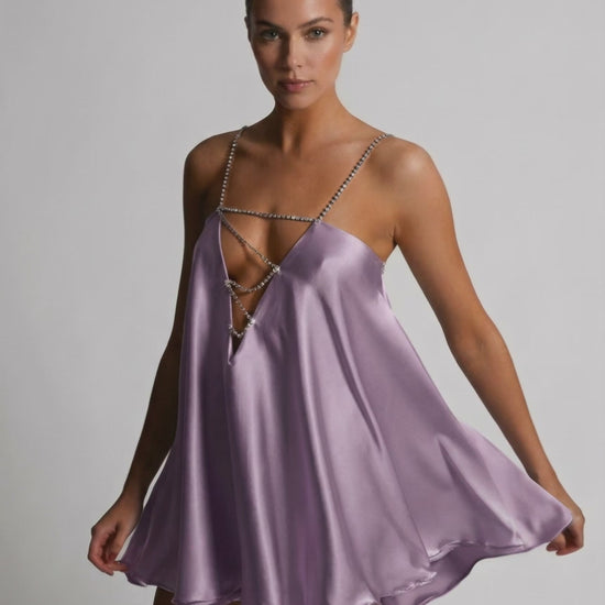 Lyra Mini Dress by Lauven in soft lilac, featuring a luxurious satin finish and rhinestone detail, perfect for summer occasions.