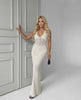 Elara Maxi Dress - Elegant white knit dress with deep V-neck, ribbed silhouette by Lauven, perfect for day-to-evening wear.
