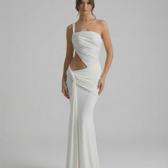 Elara Maxi Dress featuring asymmetrical draping, backless design, and elegant silhouette by Lauven.