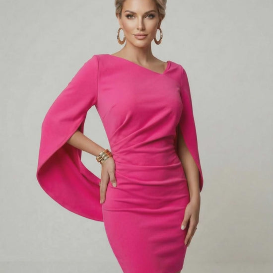 Fiora Mini Dress by Lauven in vibrant hot pink with dramatic cloak sleeves and a flattering sheath design.