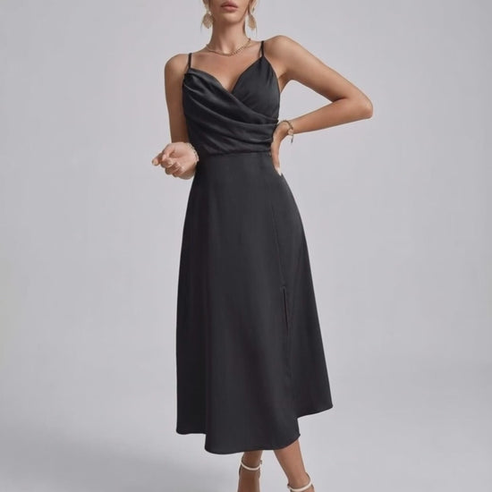 Noiré Midi Dress featuring a sleek black satin finish, delicate spaghetti straps, and refined cowl neck design by Lauven.