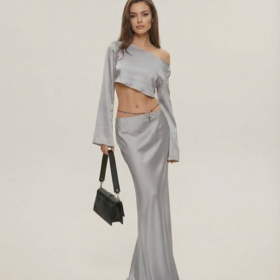Nova Midi Dress by Lauven in elegant silver, featuring asymmetrical design and chic slash neckline.