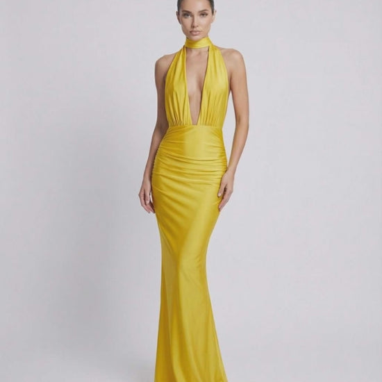 Solara Maxi Dress in vibrant yellow, featuring halter neckline, deep plunge, and high waist by Lauven.