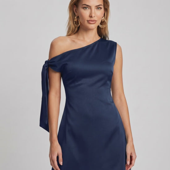 Veloura Mini Dress by Lauven, featuring satin finish, asymmetric neckline, modern A-line silhouette.
