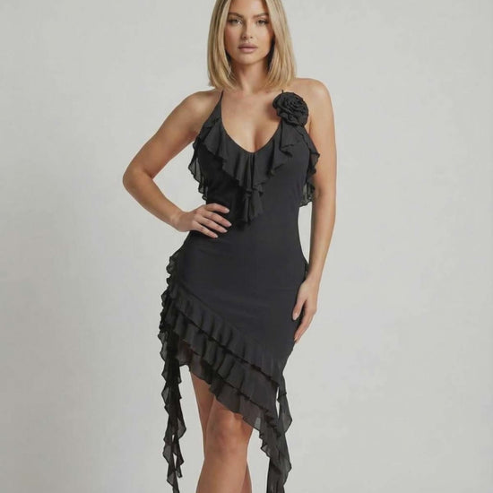 Noir Mini Dress by Lauven with ruffle detail and asymmetric hemline in classic black.