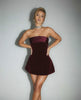 Orion Mini Dress showcasing a luxurious burgundy velvet silhouette, featuring a strapless design by Lauven.