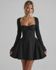 Noir Mini Dress showcasing a flattering fit-and-flare silhouette, long sleeves, and ruched bow detail by Lauven.
