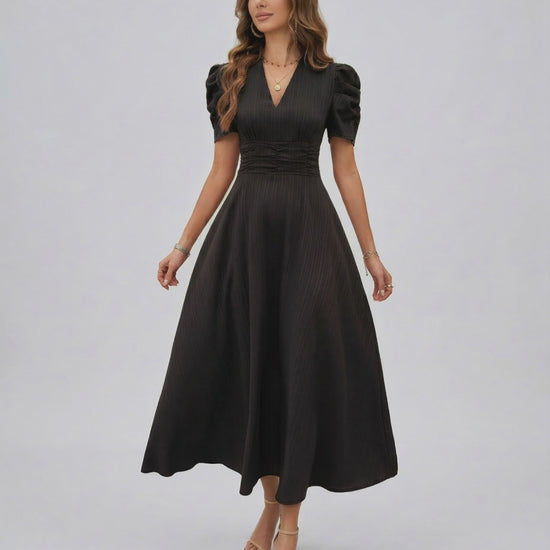 Noire Midi Dress by Lauven, elegant black midi dress with puff sleeves and V-neckline for sophisticated occasions.