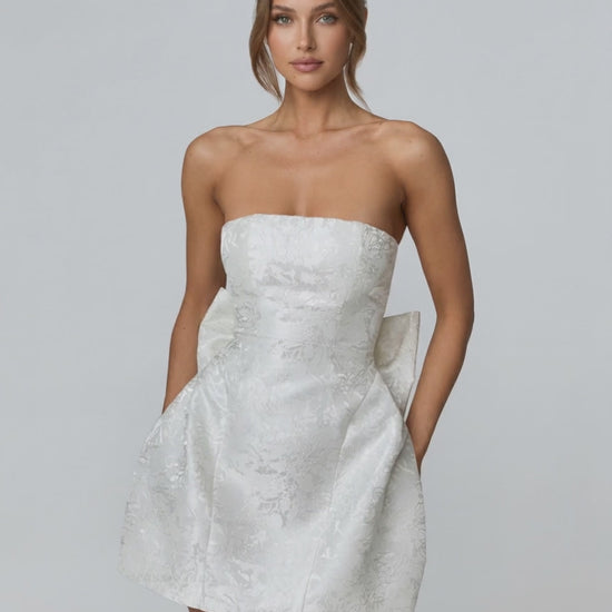 Ivory Mini Dress by Lauven, featuring a strapless neckline, A-line silhouette and pockets for a stylish look.
