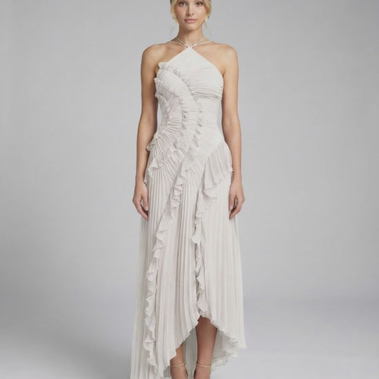 Seren Maxi Dress by Lauven - Classic ivory pleated halter gown with ruffle accents and asymmetrical high-low hem.