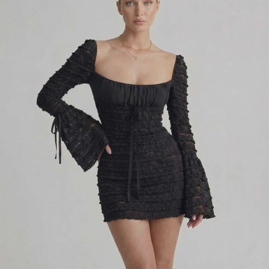 Luna Mini Dress by Lauven featuring elegant sheath silhouette, flare sleeves, and textured black fabric for modern luxury.