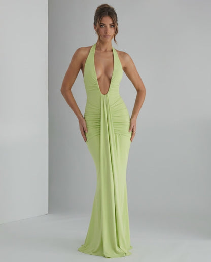 Aurelia Maxi Dress in light green, featuring a halter neck and smooth stretch jersey fabric for a sleek silhouette.