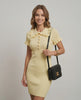 Lemon Knit Dress by Lauven – Elegant ribbed mini dress with collar, featuring a charming ruffled design and fitted silhouette.
