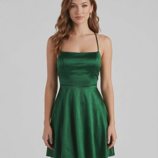 Emerald Satin Mini by Lauven – Elegant green A-line mini dress with spaghetti straps and satin finish.