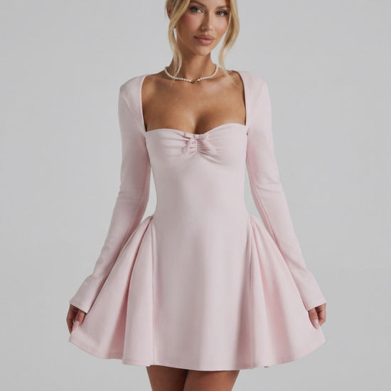Elvire Mini Dress featuring elegant long sleeves, flattering fit, ruched neckline in soft pink by Lauven.