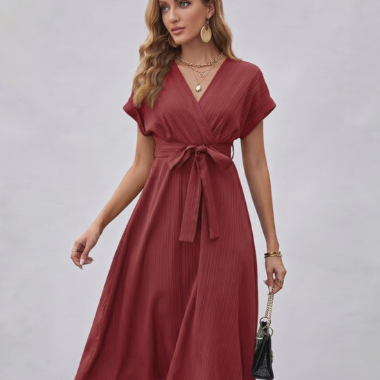 Serene Midi Dress in rich burgundy with pleated fabric, V-neck, self-tie belt by Lauven for a stylish and refined look.