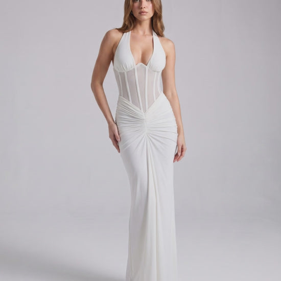 Velmira Maxi Dress by Lauven in white, featuring halter neck, bodycon fit, sheer mesh panel and luxe polyester-spandex blend.