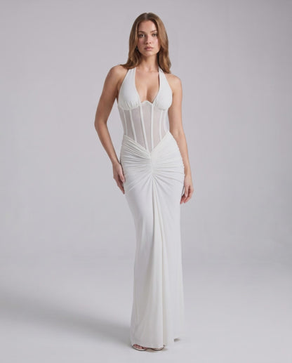 Velmira Maxi Dress by Lauven in white, featuring halter neck, bodycon fit, sheer mesh panel and luxe polyester-spandex blend.
