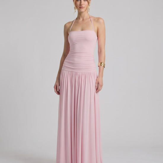 Elara Maxi Dress in pink, featuring a halter neck, smooth stretch jersey, and a flowing maxi skirt for a chic look by Lauven.