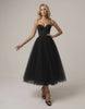Noiré Midi Dress by Lauven - Elegant black strapless dress with corset bodice and tulle skirt.