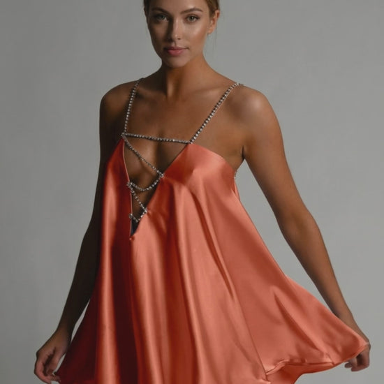 Marigold Mini Dress by Lauven featuring satin flared silhouette and elegant beaded spaghetti straps in burnt orange.