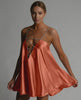 Marigold Mini Dress by Lauven featuring satin flared silhouette and elegant beaded spaghetti straps in burnt orange.