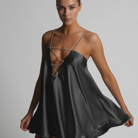 Midnight Mini Dress by Lauven, featuring an A-line silhouette, V-neck, and spaghetti straps for a sexy summer look.