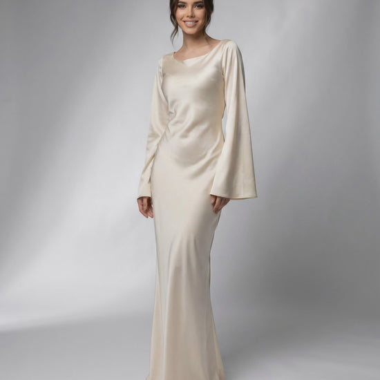 Liora Maxi Dress by Lauven, featuring a flowing silhouette, elegant bell sleeves, and luxurious satin fabric.