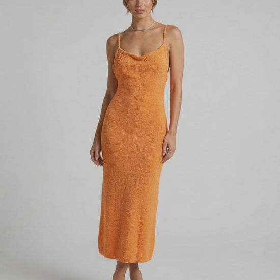 Valencia Midi Dress by Lauven in vibrant orange, featuring spaghetti straps and a flattering slim silhouette.