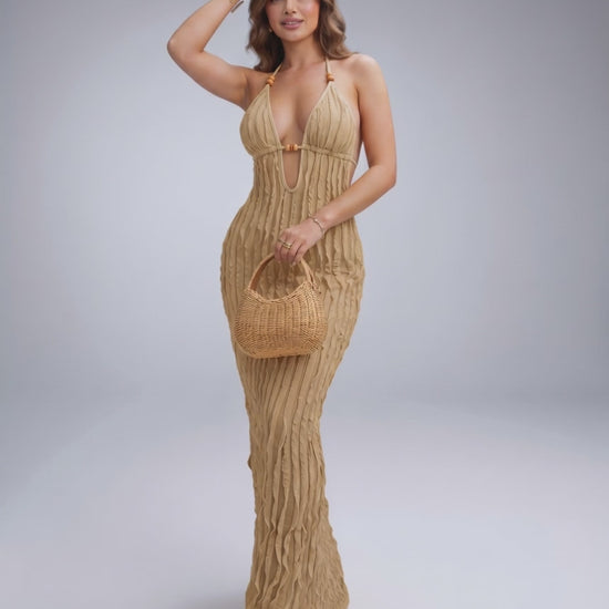 Lunara Maxi Dress in textured polyester blend, featuring halter V-neck, perfect for warm-weather styling by Lauven.