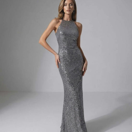 Orion Maxi Dress: Silver sequin dress with halter neck, sleek silhouette, by Lauven for an elegant evening look.