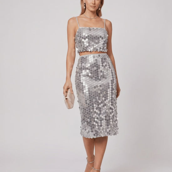Lustra Sequin Set - A high-shine two-piece evening outfit featuring a sequined cropped top and midi skirt by Lauven.