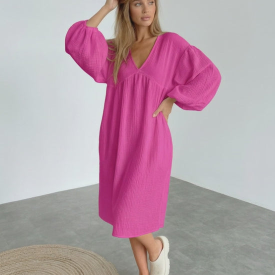 Zafira Midi Dress in vibrant pink, featuring puff sleeves, designed by Lauven for a stylish and comfortable look.