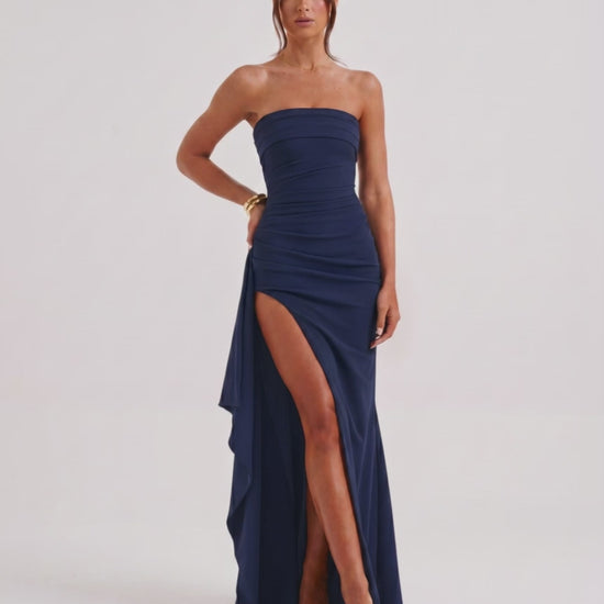 Solenne Maxi Dress by Lauven, features strapless bandeau design, high waist, dramatic side slit, and fluid polyester fabric.