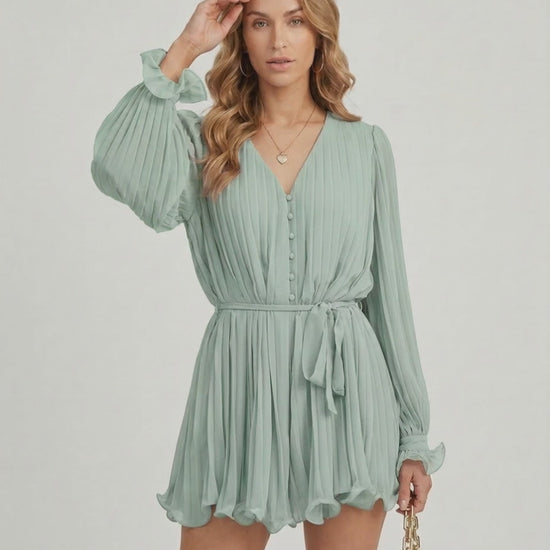 Aurelia Mini Dress by Lauven in soft sage green chiffon with pleated texture and V-neck design.