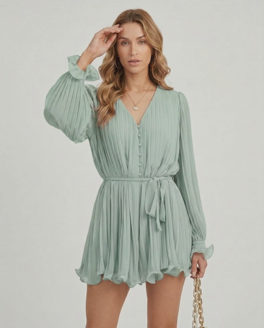 Aurelia Mini Dress by Lauven in soft sage green chiffon with pleated texture and V-neck design.